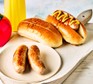 Air fryer sausages served in hot dog buns