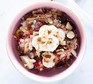 Bircher muesli topped with grated apple and sliced banana