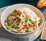 Broad bean pasta in a bowl with a fork