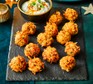 Carrot & halloumi fritters with coriander dip served on a platter