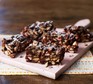 Squares of rocky road on a chopping board