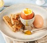 Soft boiled eggs served with soldiers