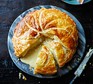 Cheese and potato pie with slice cut out