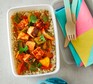Paneer jalfrezi with brown rice in a lunch box