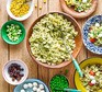 Pick & mix pesto pasta salad bar arranged in bowls