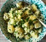 Potato salad in bowl with spoon
