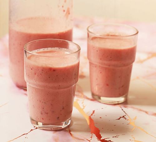 Three glasses of raspberry and apple smoothie