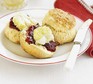 Scones with jam & clotted cream on a plate