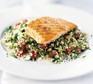 Tabbouleh on a plate, topped with salmon