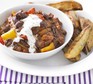 Vegetarian mixed-bean chilli served with wedges