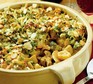 Close up of chicken & broccoli pasta bake in a round serving dish