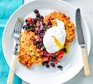 A plate of sweetcorn fritters with black bean salsa and a poached egg